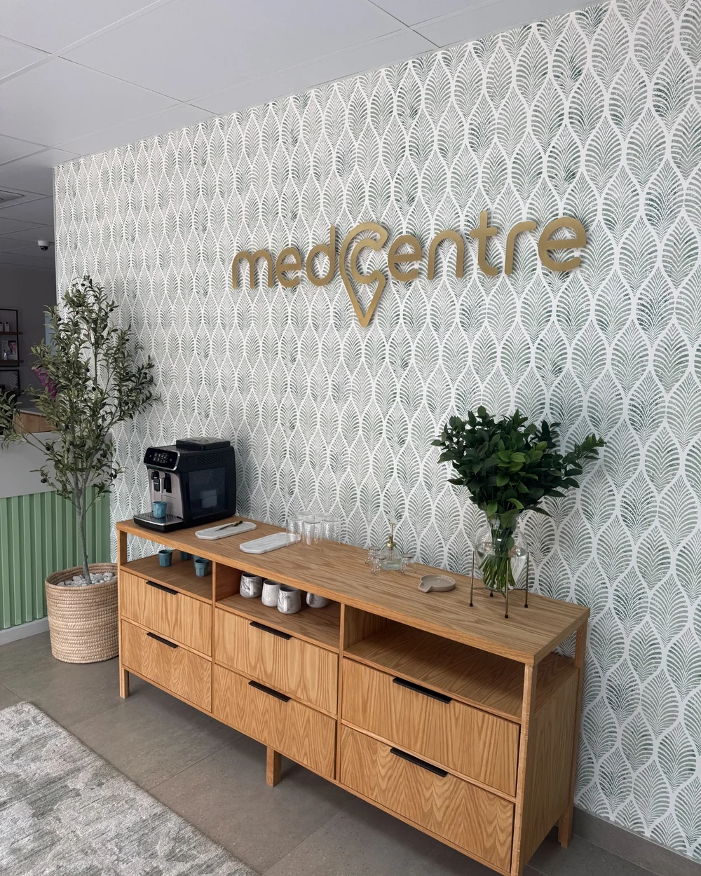 MedCentre Waterkloof interior showing the branded wall and hospitality station